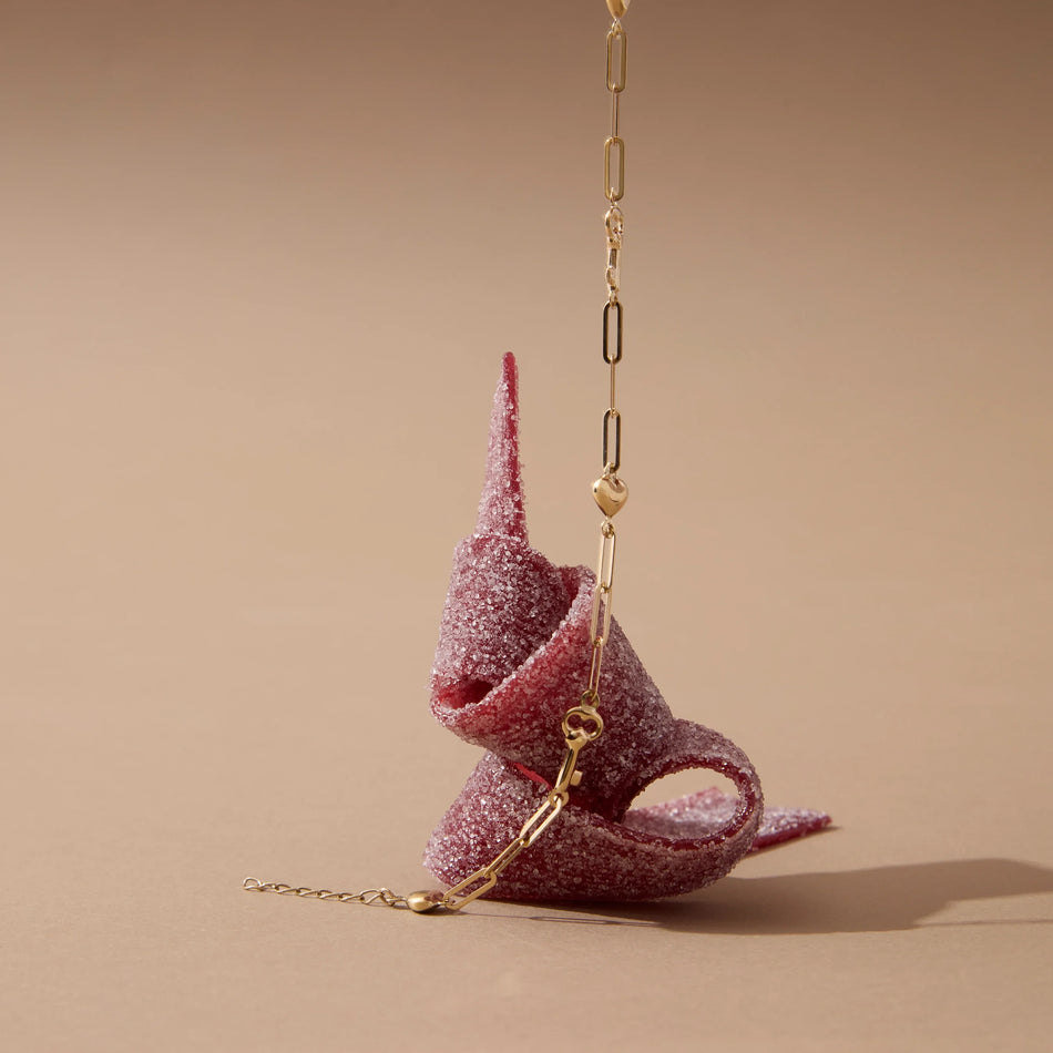 golden bracelet on beige background