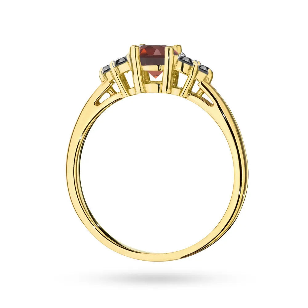 Gold 14k(585) ring with 0,60ct garnet with 6 black diamonds. Perfect for a gift.
