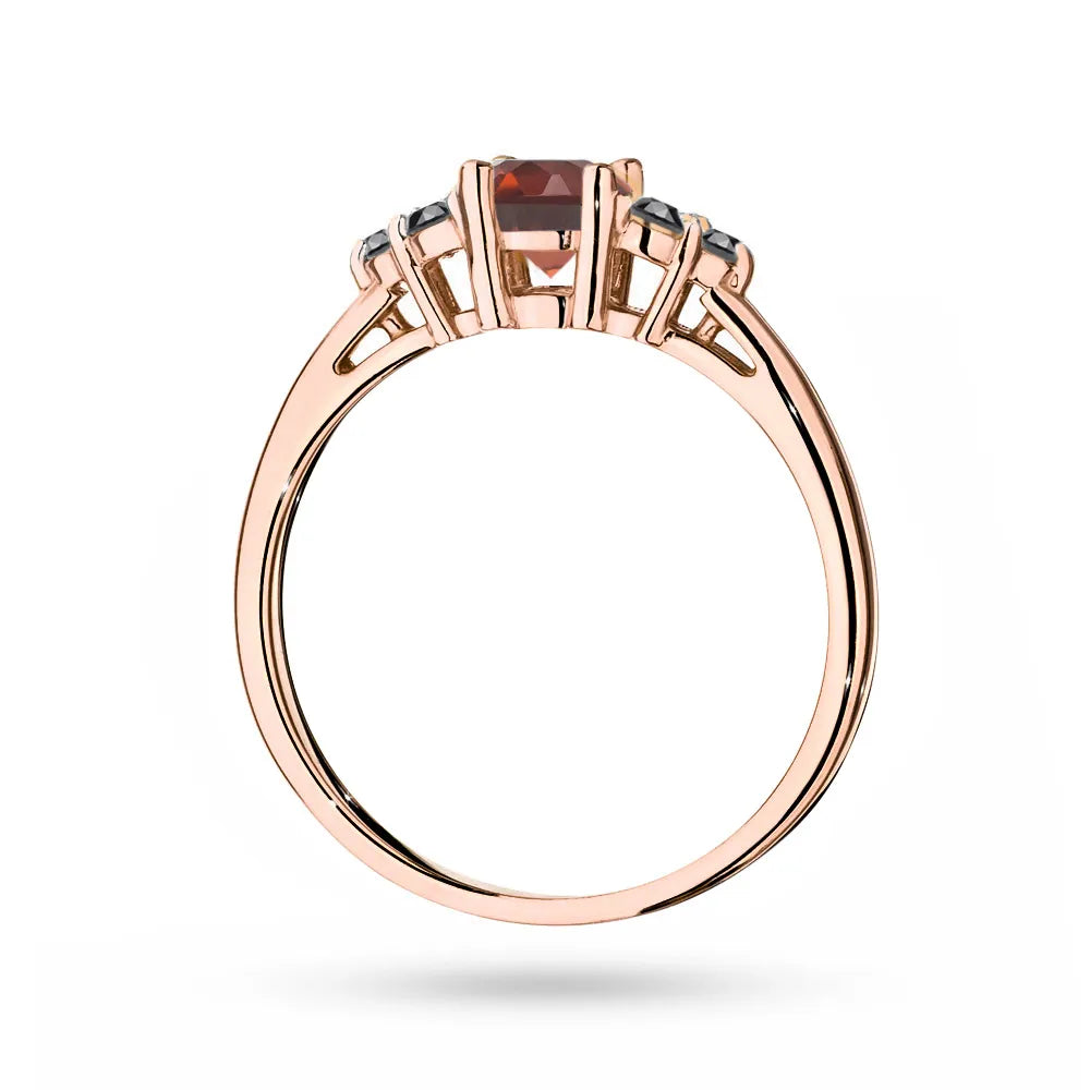 Rose Gold 14k(585) ring with 0,60ct garnet with 6 black diamonds. Perfect for a gift.