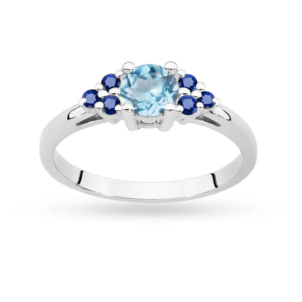 Bague en or blanc 14 carats (585) avec topaze de 0,50 ct et 6 saphirs. Parfaite pour un cadeau.