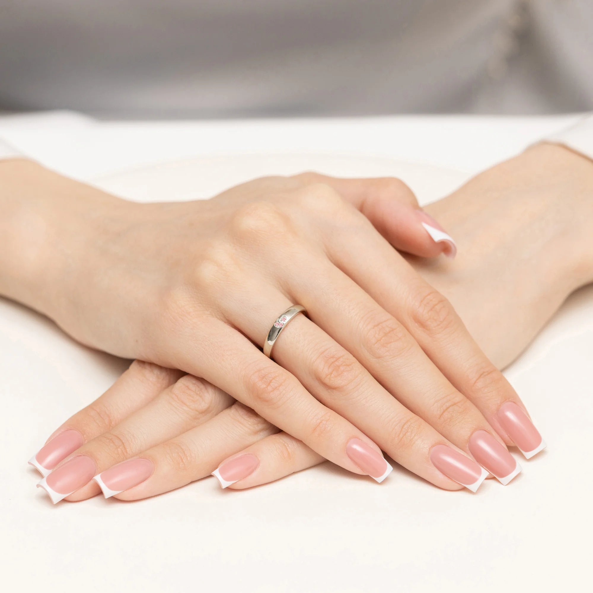 14k white gold ring with 2 pink zirconia hearts. Excelent gift. Perfect for everyday and special occasions.