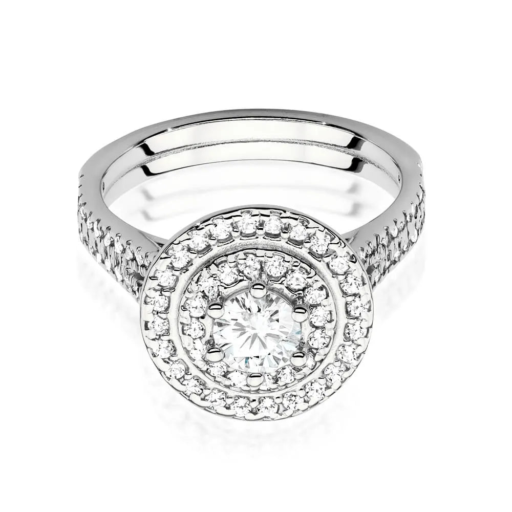 Náušnice z bílého zlata 14k (585) s diamantem o hmotnosti 0,40 ct a postranními diamanty o celkové hmotnosti 0,613 ct. Balené v elegantní krabičce, která je ideální jako dárek.