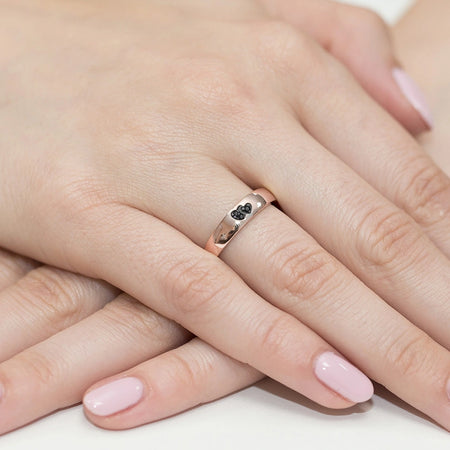 14k rose gold ring with 2 black zirconia hearts. Classic design with modern twist. Packed in black box, paper, and gift bag.