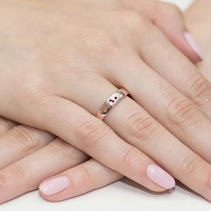 Gremari 14k rosegold ring with 2 red zirconia hearts. Ring is packed in elegant black box, paper, and a gift bag.