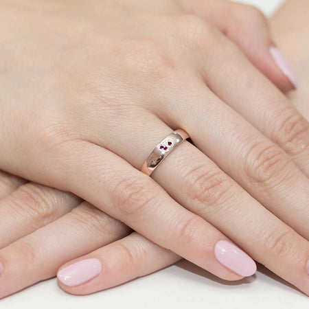 Gremari 14k rosegold ring with 2 red zirconia hearts. Ring is packed in elegant black box, paper, and a gift bag.