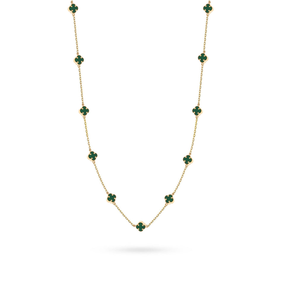 Goldkette mit grünen Glückskleeblättern