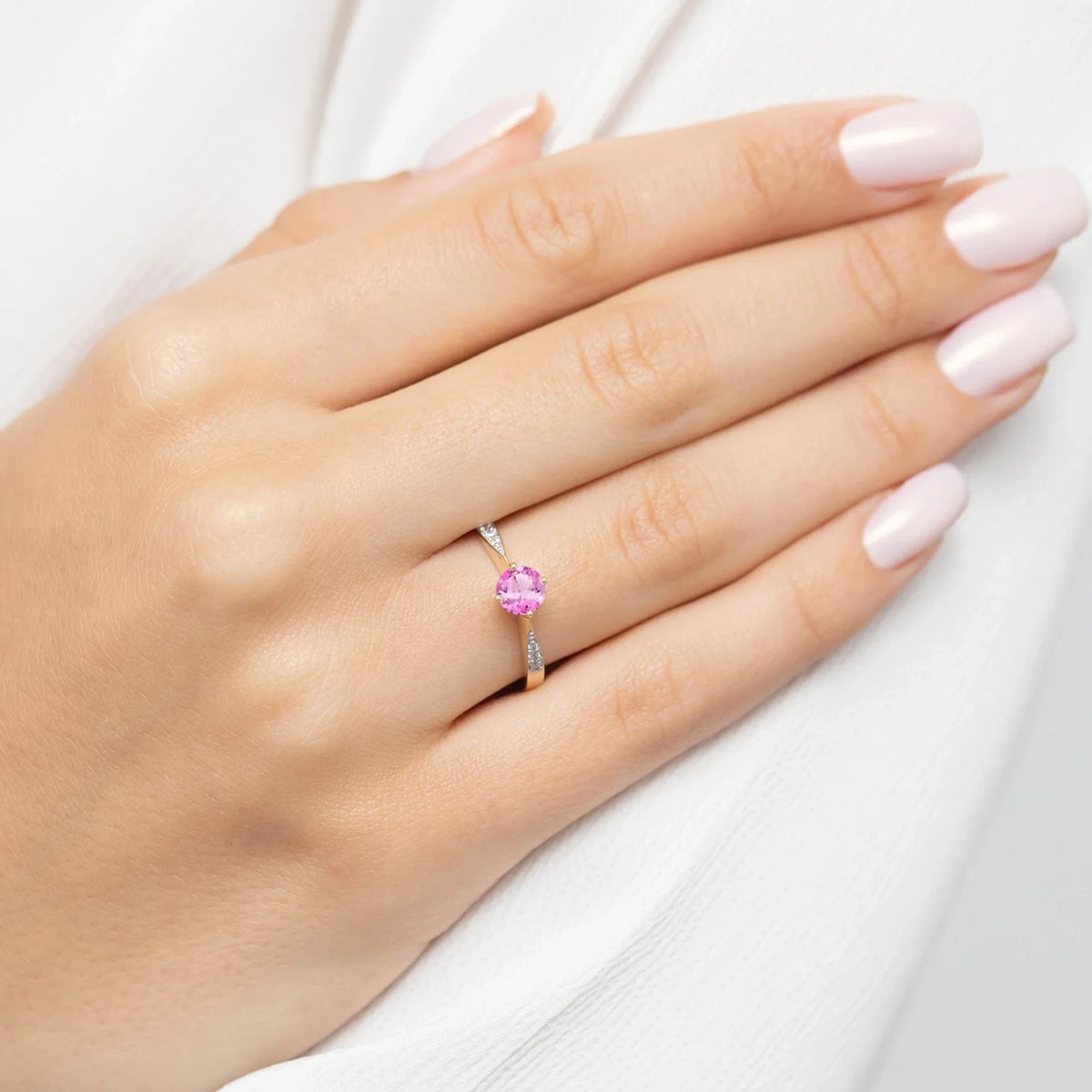 zlatý prsteň so 0,60 ct ružovým topásom a 0,068 ct diamantmi p167-585-rt0-60