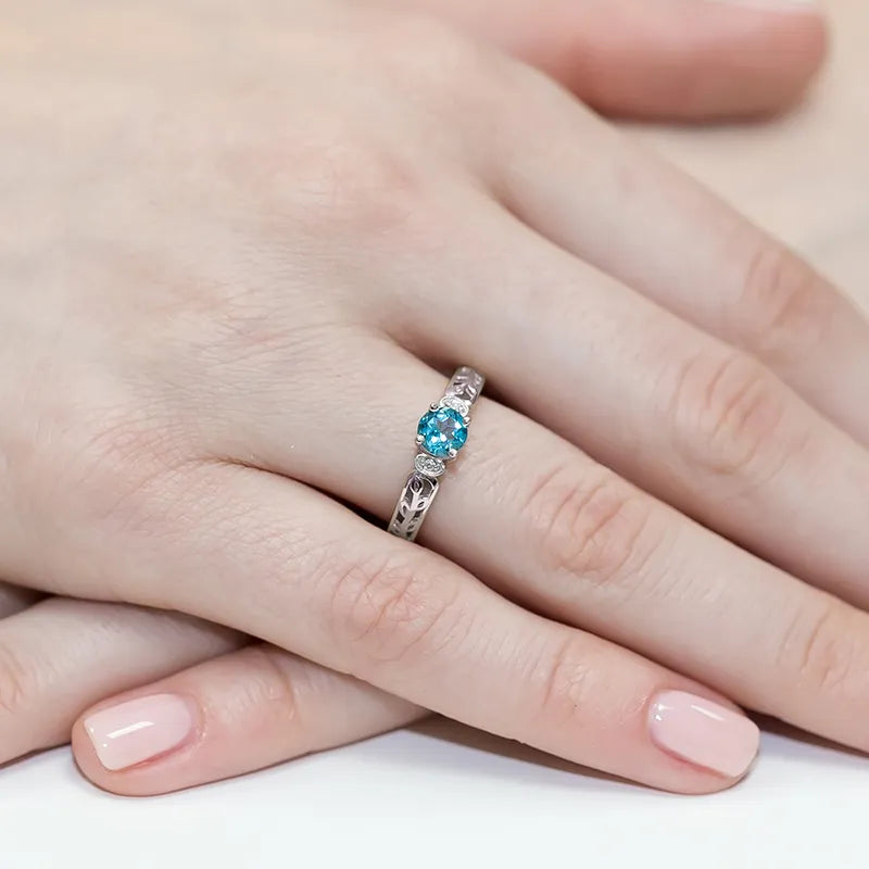 zlatý prsteň s topásom 0,50 ct a diamantmi 0,02 ct w0014-tob-01