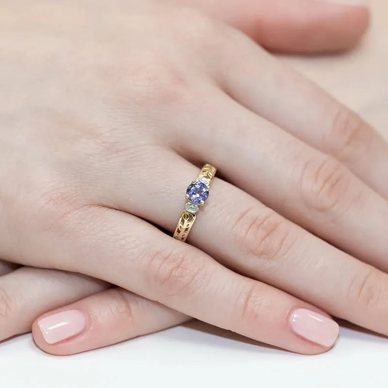 gold-ring-with-0-50ct-tansanit-and-0-02ct-diamonds-w0014-tap-01