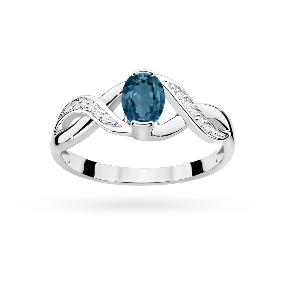 Bague en or blanc avec topaze London Blue 0,50 ct et diamants 0,05 ct