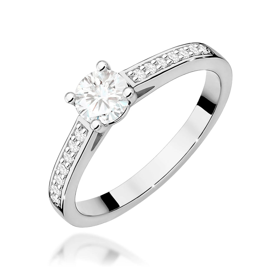 Prsten z bílého zlata s 0,50ct a 0,12ct diamanty