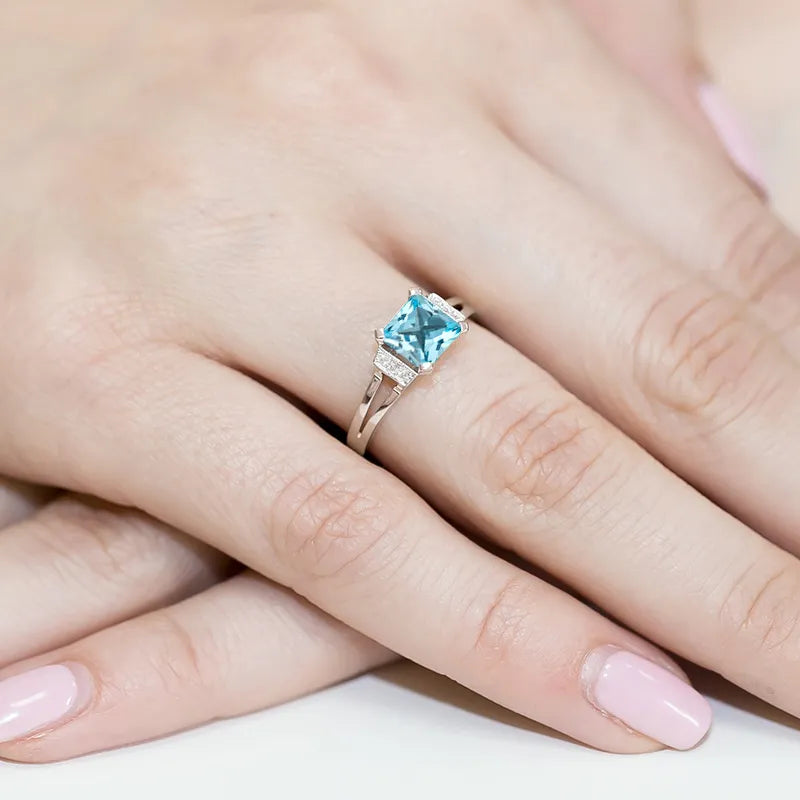 zlatý prsten s topazem 1,40 ct a diamanty 0,03 ct w0103-tob-01