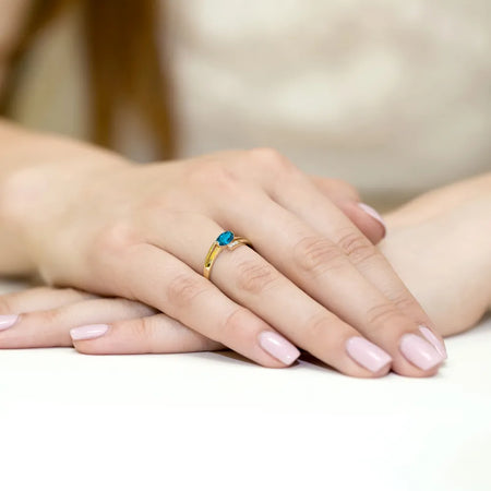 gold-ring-with-0-50ct-topaz-london-blue-and-0-052ct-diamonds-w0119-tol-01