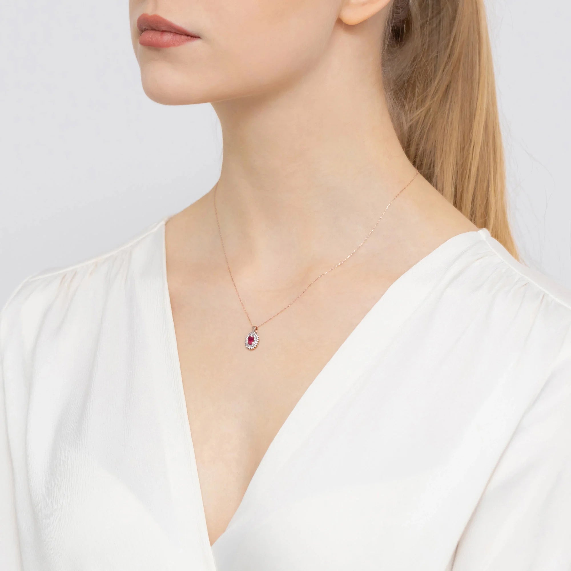 Pendant made of 14K (585) gold. Central ruby 0.60ct surrounded by 39 diamonds 0.19ct. A unique gift for her. Our shop offers chains, rings, earrings or armbands